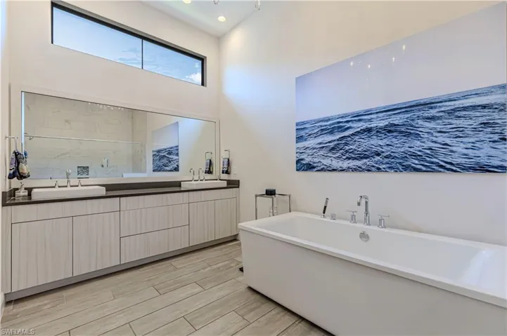 Master bathroom featuring double vanity, a freestanding tub