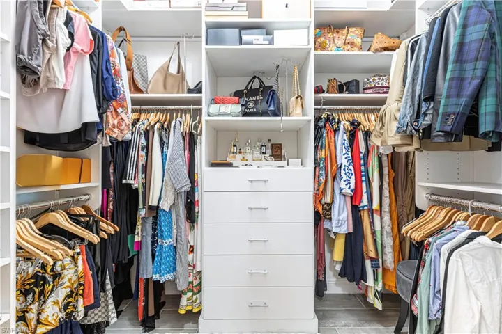 Walk in closet with custom shelving