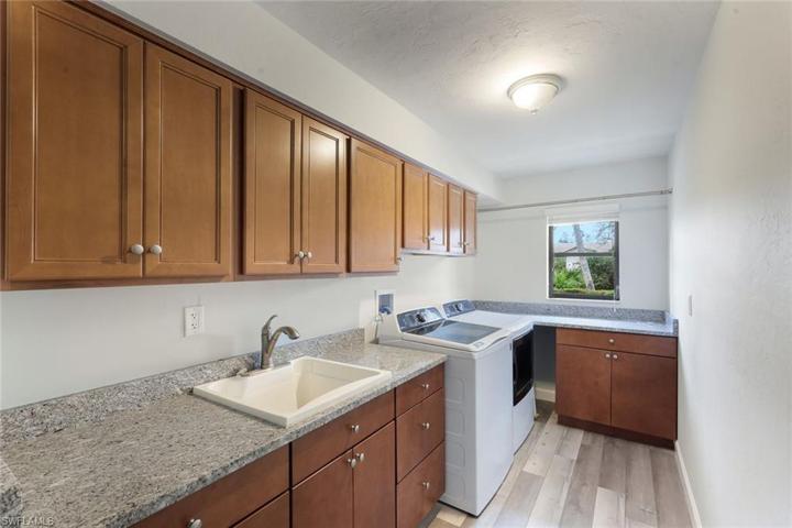 What a Laundry Room! Wood Cabinetry, Granite Counters! Appliances Stay, Utility Sink, Tons of Storage & Counter Space