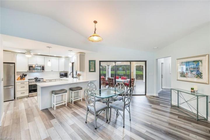 Kitchen Has a Breakfast Bar, Photo Shows Hallway to Private Guest Rooms