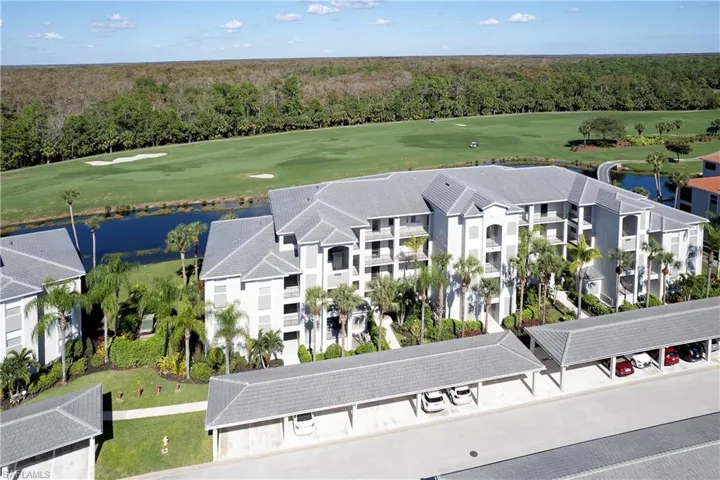 Aerial view. Unit is ground-floor with water and golf course view.