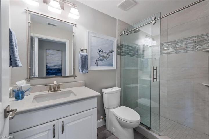 Guest bathroom with frameless glass sliding doors!