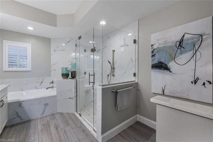 Walk in shower with frameless glass enclosure.