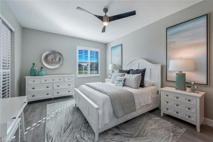 Primary Suite with direct access to the lanai and lovely plantation shutters!