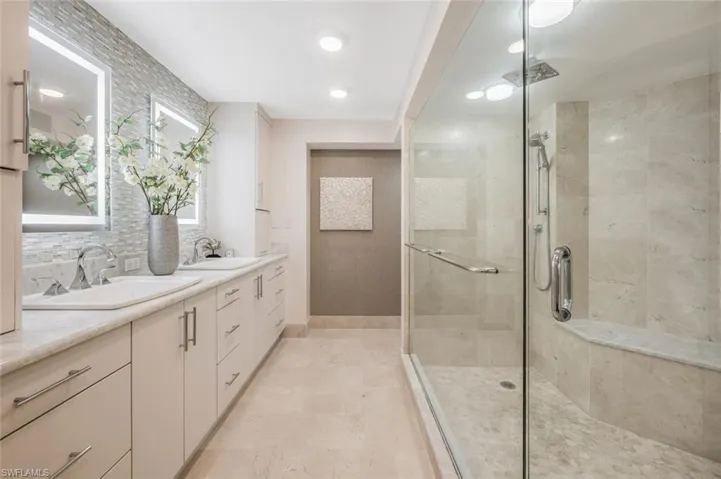 Bathroom with vanity and an enclosed shower