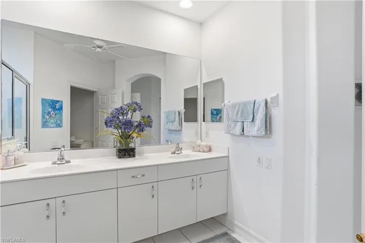 Dual vanity with integrated sinks and chrome fixtures