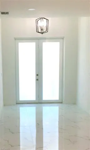 Entryway featuring french doors
