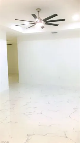 Living room with tile patterned floors plus bonus room
