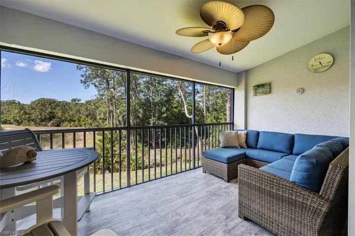 Sunroom / solarium with an outdoor hangout area and a ceiling fan