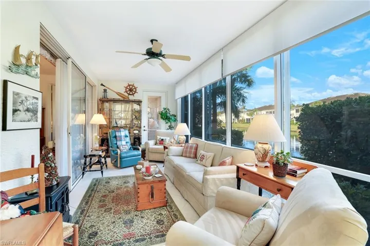Impact Glass sliders that open out to a lake view.  Former furnished photo.