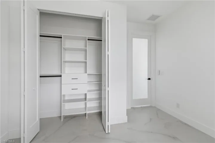 Unfurnished bedroom with baseboards and a closet
