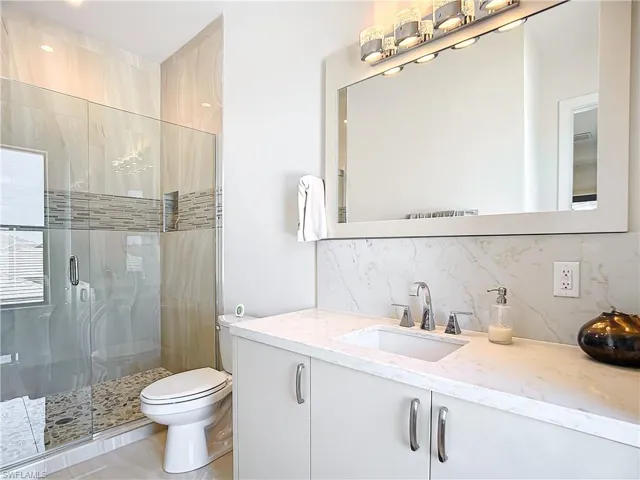 Ensuite Bathroom to First Guest Bedroom on Second Floor