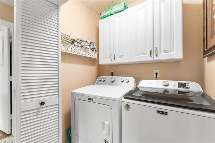 Laundry room has storage cabinets. Washer 2022. Dryer 2020.