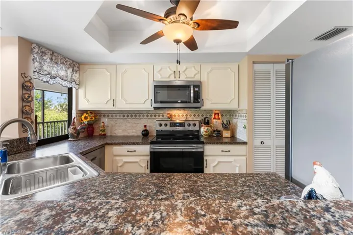 Tumbled marble backsplash.