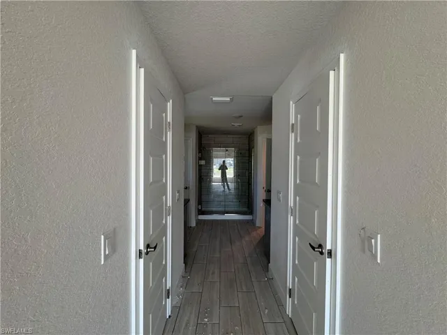 Dual walk in closet spaces entering the bathroom