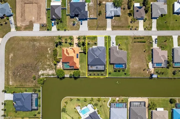 Birds eye view of property featuring a residential view and a water view