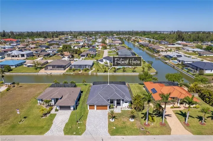 Birds eye view of property featuring a residential view and a water view