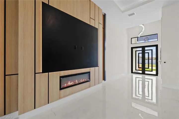 Interior details featuring visible vents and a large fireplace