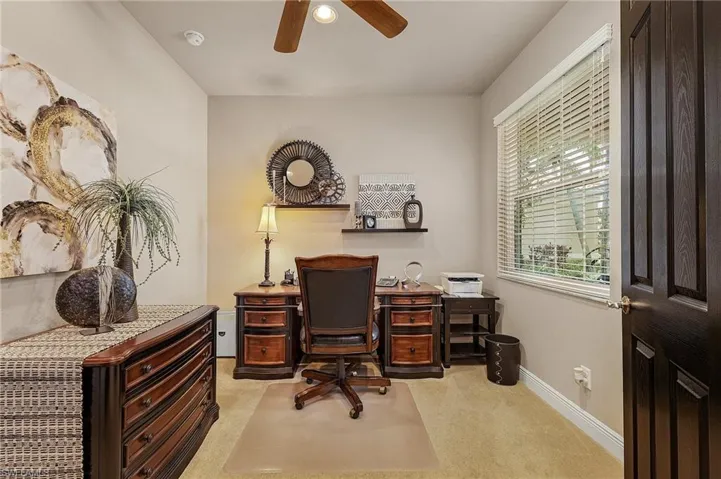 This room is currently used as an office but can easily serve as an additional bedroom.