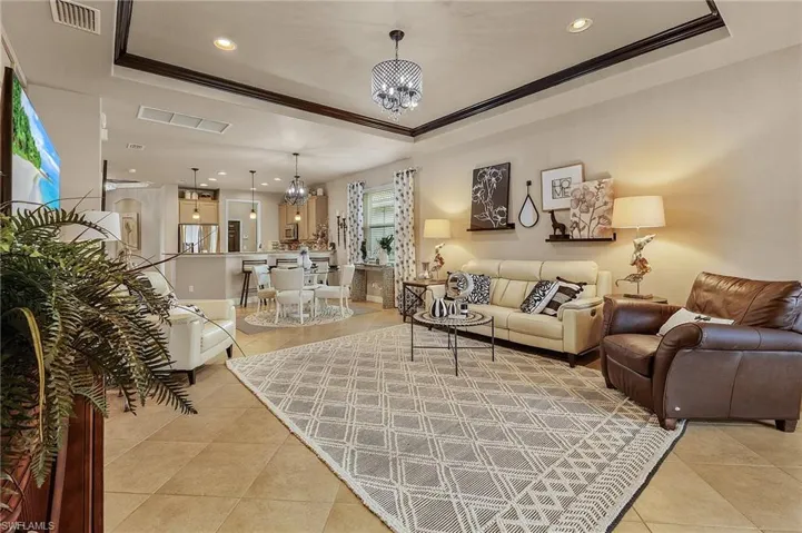View of living room, dining and kitchen.
