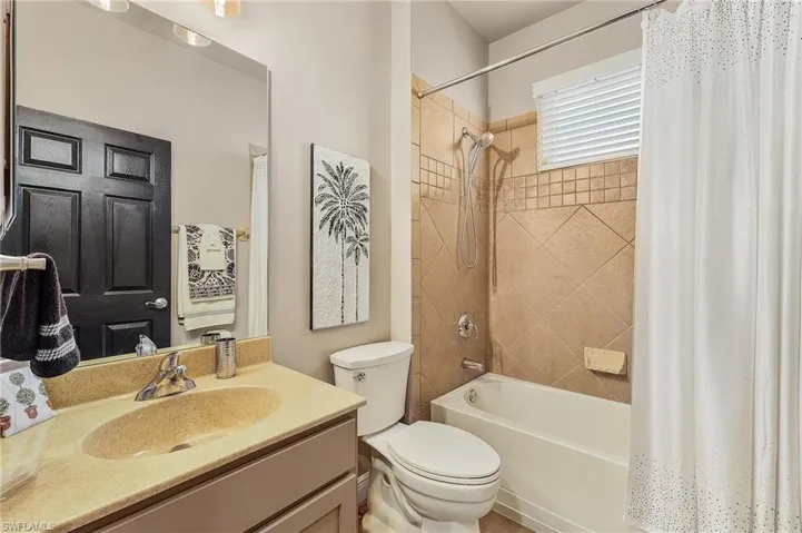 Full bathroom featuring a shower/tub combo and a vanity.