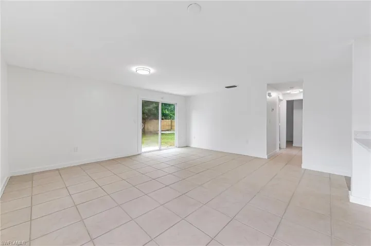 Unfurnished room featuring light tile patterned flooring