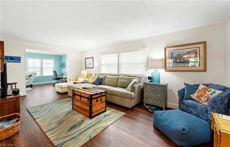 Living room featuring wood finished floors and baseboards