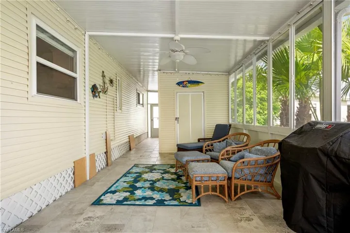 Sunroom / solarium with a ceiling fan