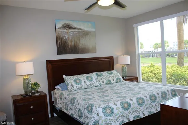 Bedroom featuring hardwood / wood-style floors and ceiling fan
