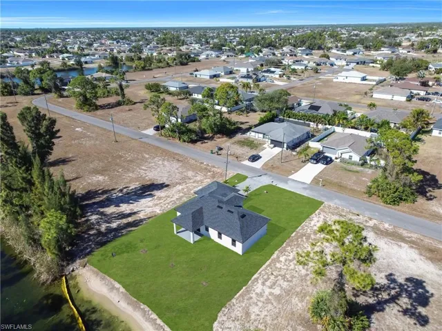 Aerial overview of property's location featuring nearby suburban area