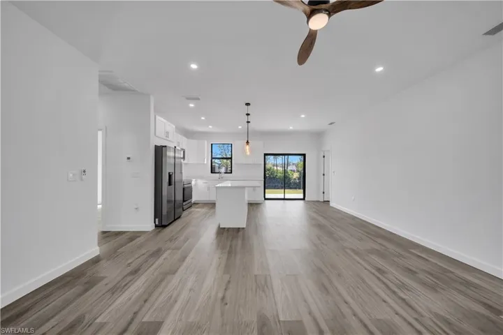 Unfurnished living room featuring recessed lighting, light wood-type flooring, and ceiling fan