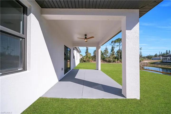 View of patio / terrace featuring ceiling fan and a water view