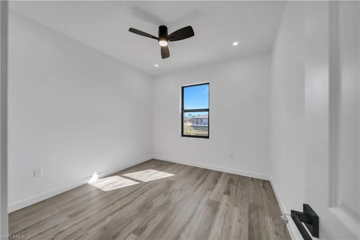Spare room featuring light wood-style flooring, recessed lighting, and a ceiling fan