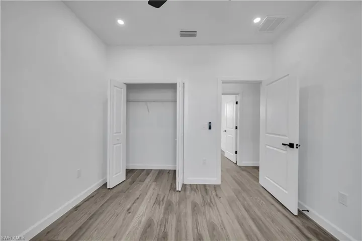 Unfurnished bedroom with recessed lighting, light wood finished floors, a closet, and a ceiling fan