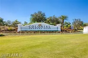 Attractive main entrance to the community that features lush landscaping and three beautifully lit fountains.