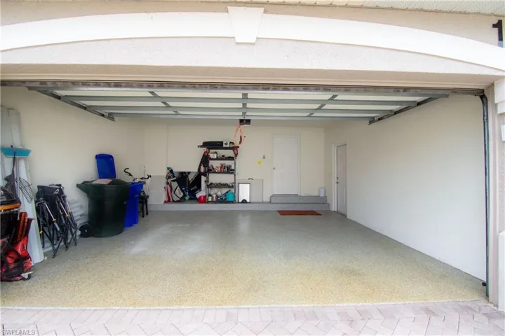 Plenty of storage in the 2 car garage.  Features a quiet door opener with a key code pad for easy entry and exit.  A side door to the outside and a door to the foyer inside.