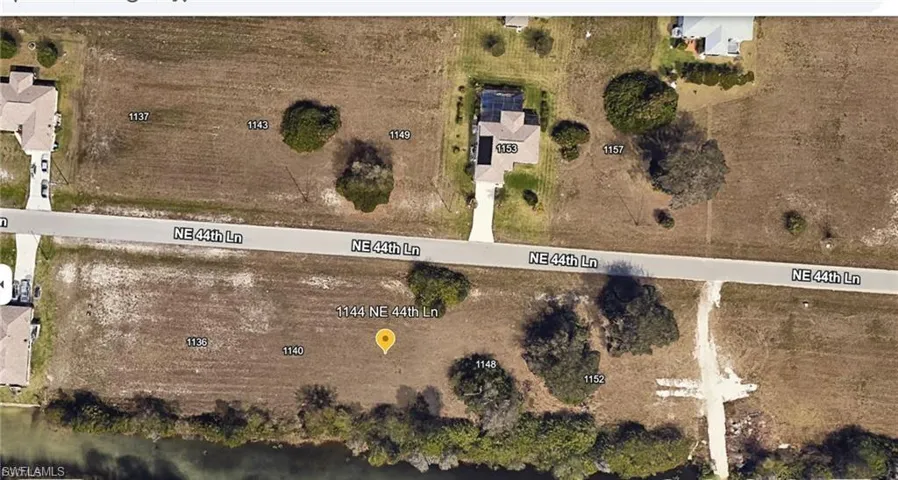 Aerial overview of property's location with property parcel outlined