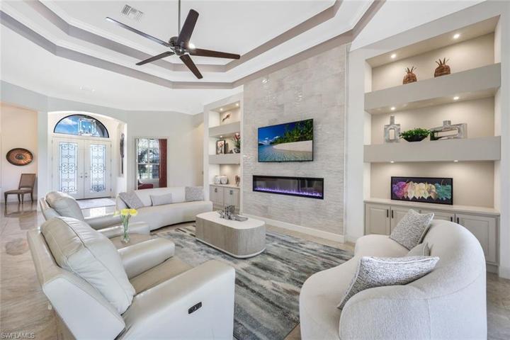 Such an impressive entryway with decorative glass double doors.