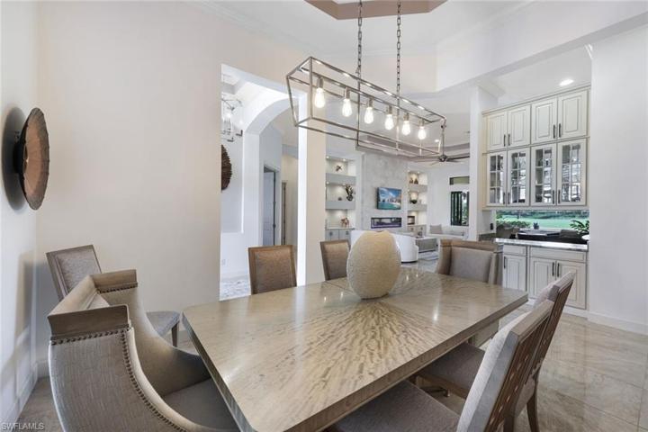 Just off the kitchen is this beautiful dining space. This home is being offered furnished, so this gorgeous dining set will convey with the sale.