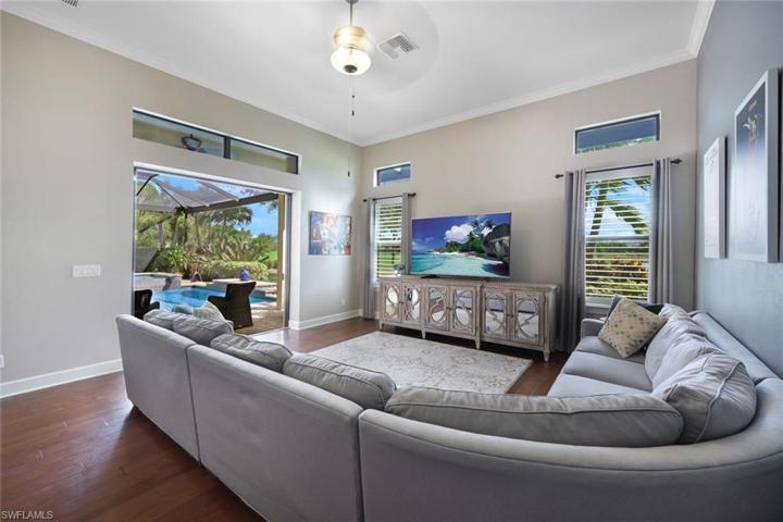 BONUS room, located just off the pool/spa, has pocket sliders, crown molding, and a sleeper sofa for additional guests.