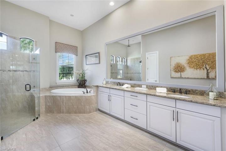 The owner's bathroom is HUGE and has an oversize walk-in shower with overhead shower system, dual sinks, and soaking tub.