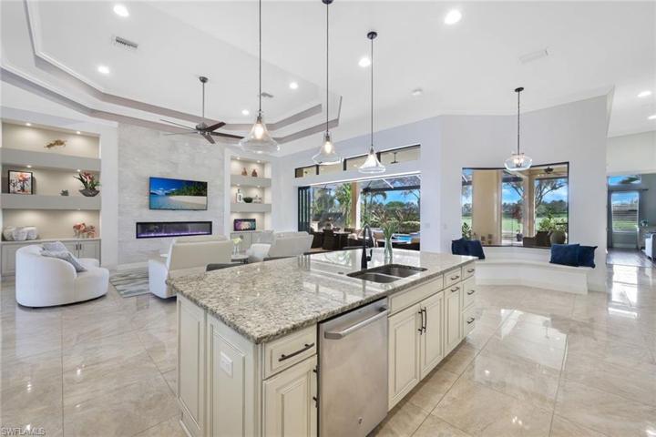 This home is perfect for entertaining... prepare a meal in this fabulous kitchen, while guests are taking in the game on the tv, or enjoying the pool/spa.