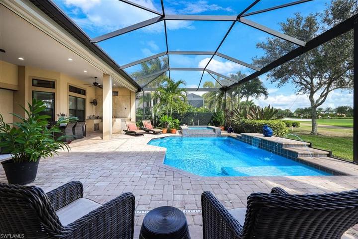 This salt water pool has a spa, sun shelf, and a number of decorative fountains.