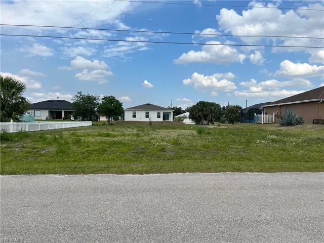 Expansive undeveloped lot featuring a grass and dirt ground cover