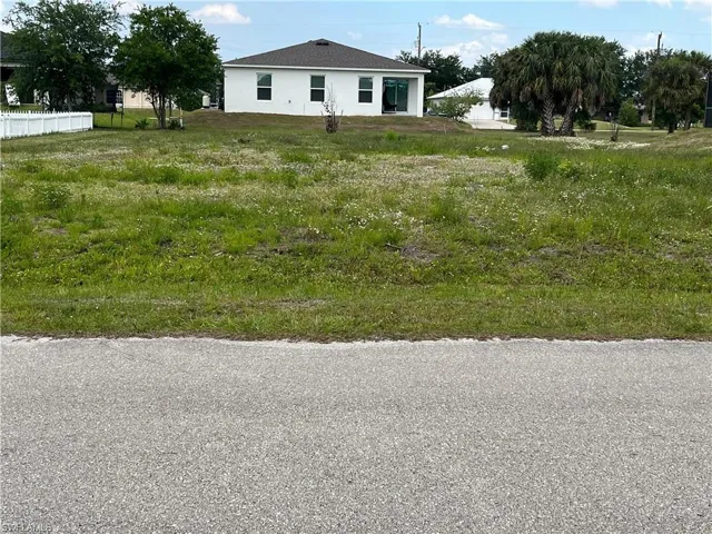 Expansive undeveloped lot featuring a grass and vegetation covering
