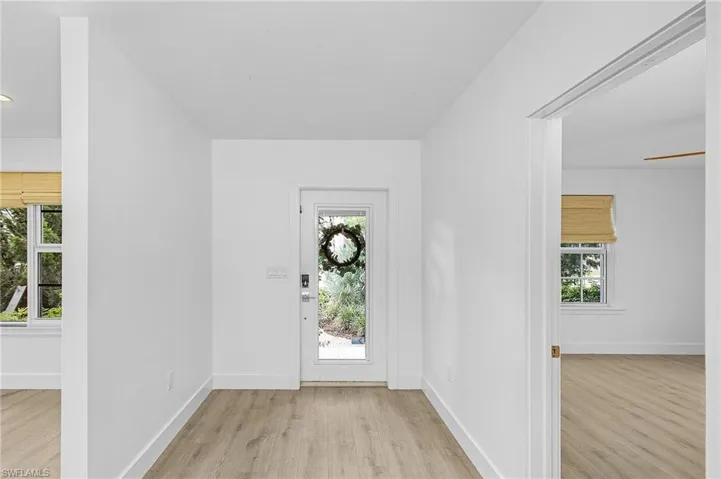 Entryway with light wood-type flooring and plenty of natural light