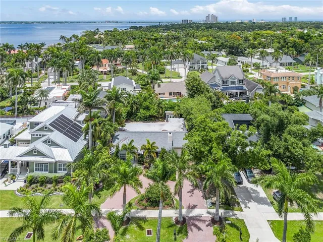 Aerial view of residential area featuring a large body of water