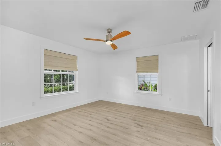 Bedroom featuring light wood-type flooring and a ceiling fan
