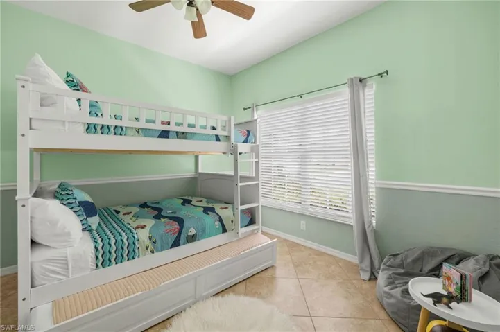 Bedroom featuring ceiling fan and light tile patterned floors