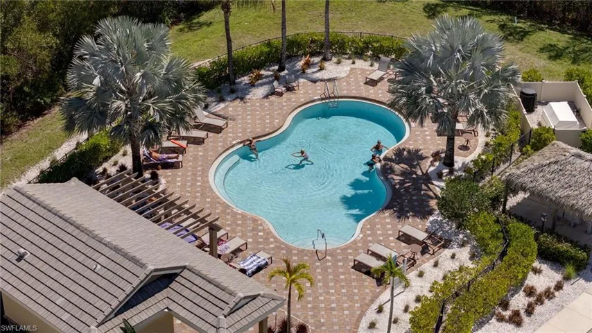 Community pool featuring a patio